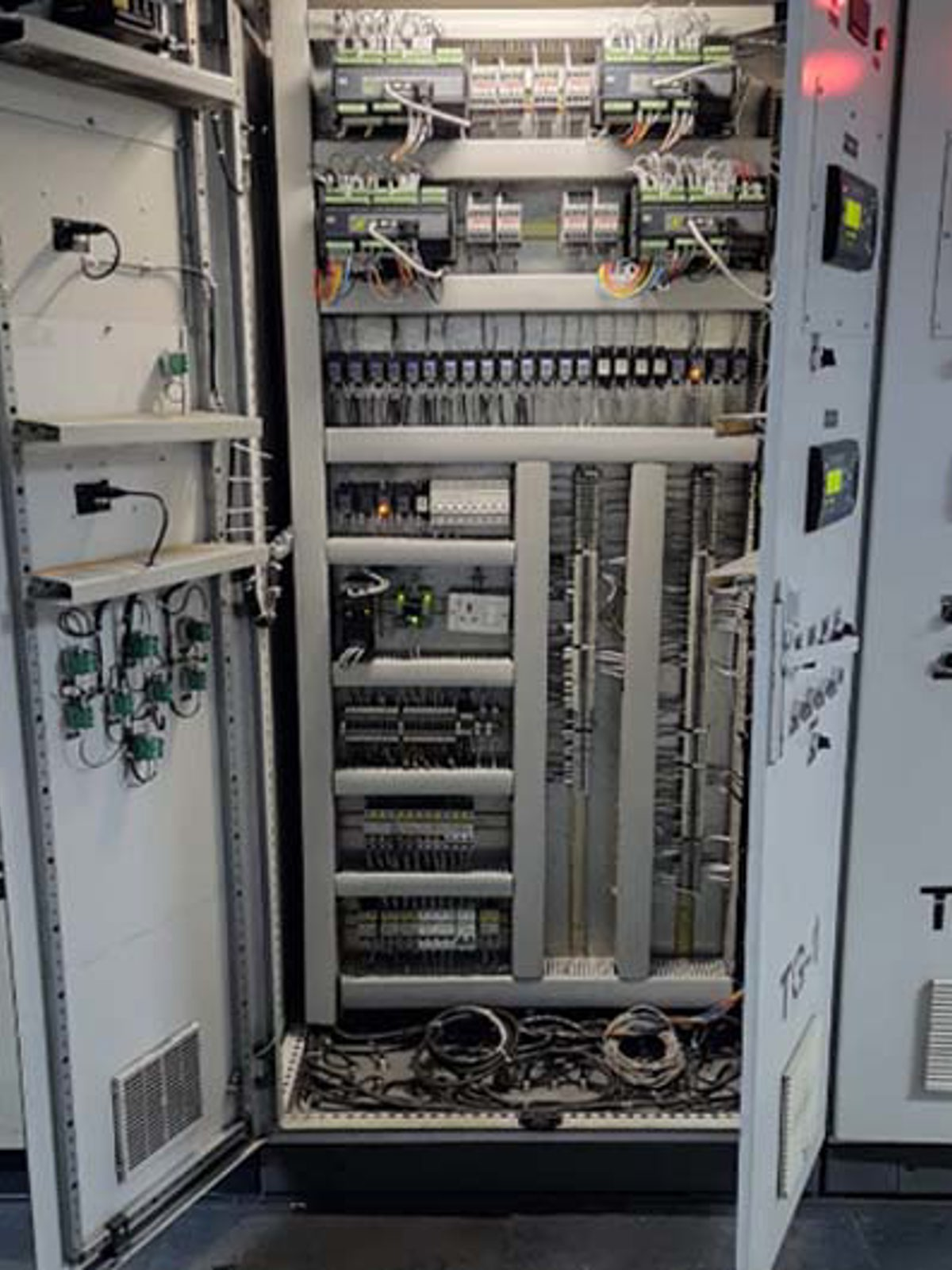 DEIF AGC-4 controllers in a switchboard at Singhal Enterprises