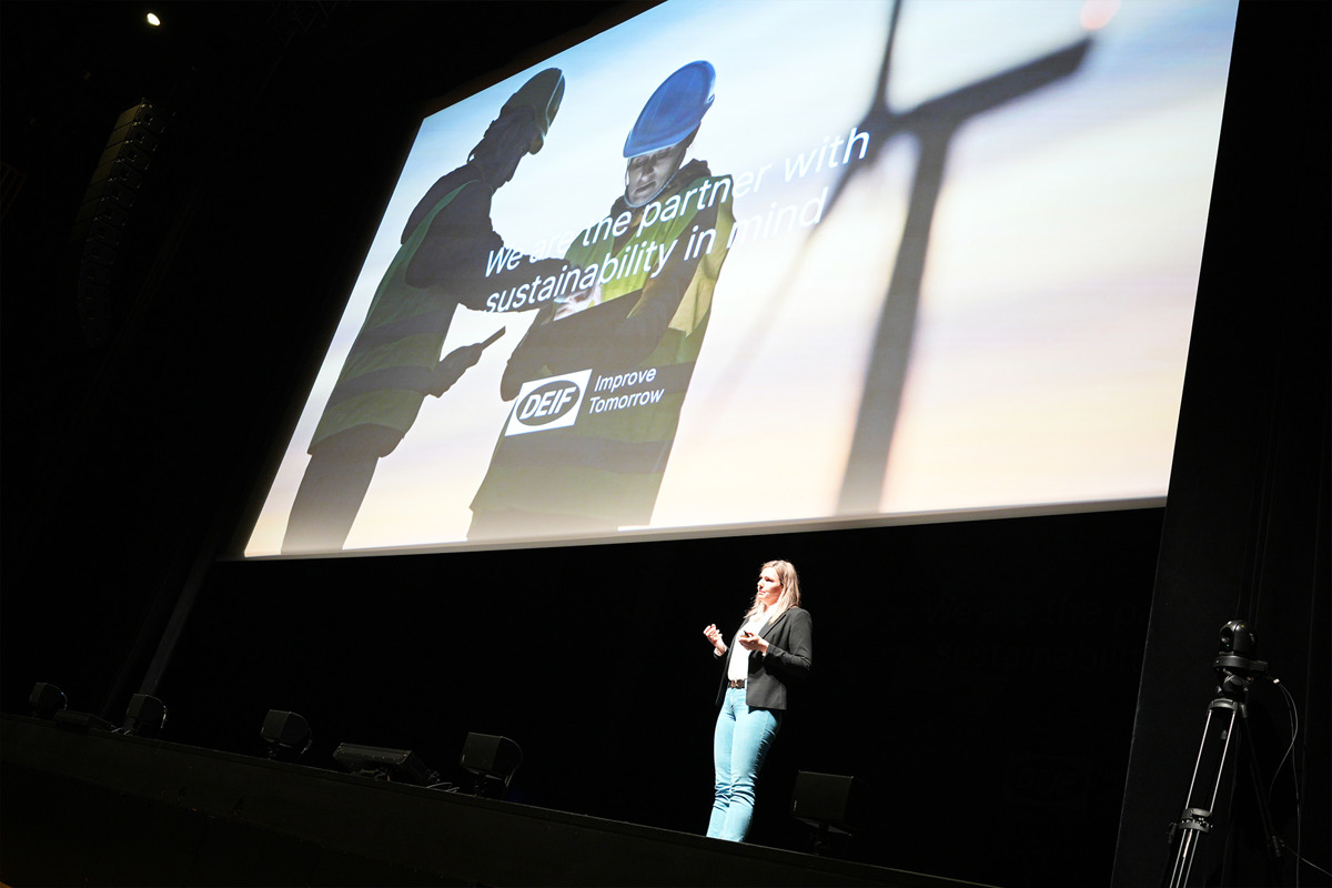 Deif rebranding - Vibeke presenting on stage